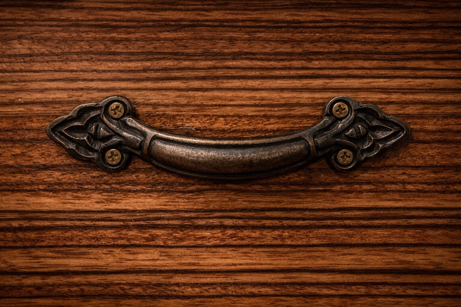 Detail of humidor handle on zebrawood exterior.
