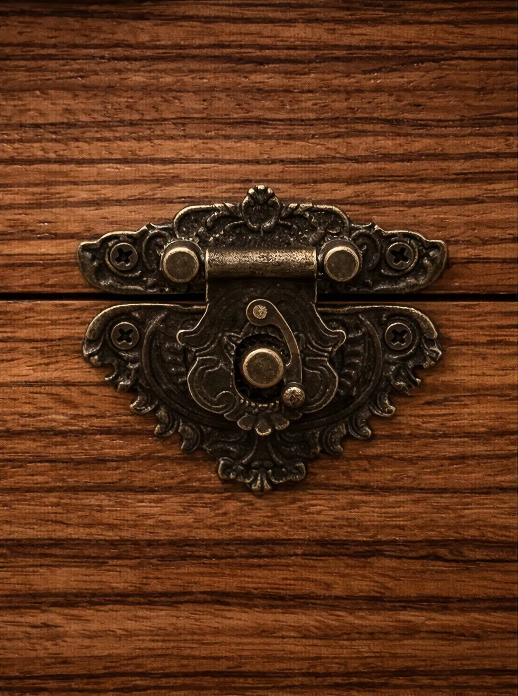 Detail of humidor latch on zebrawood exterior.