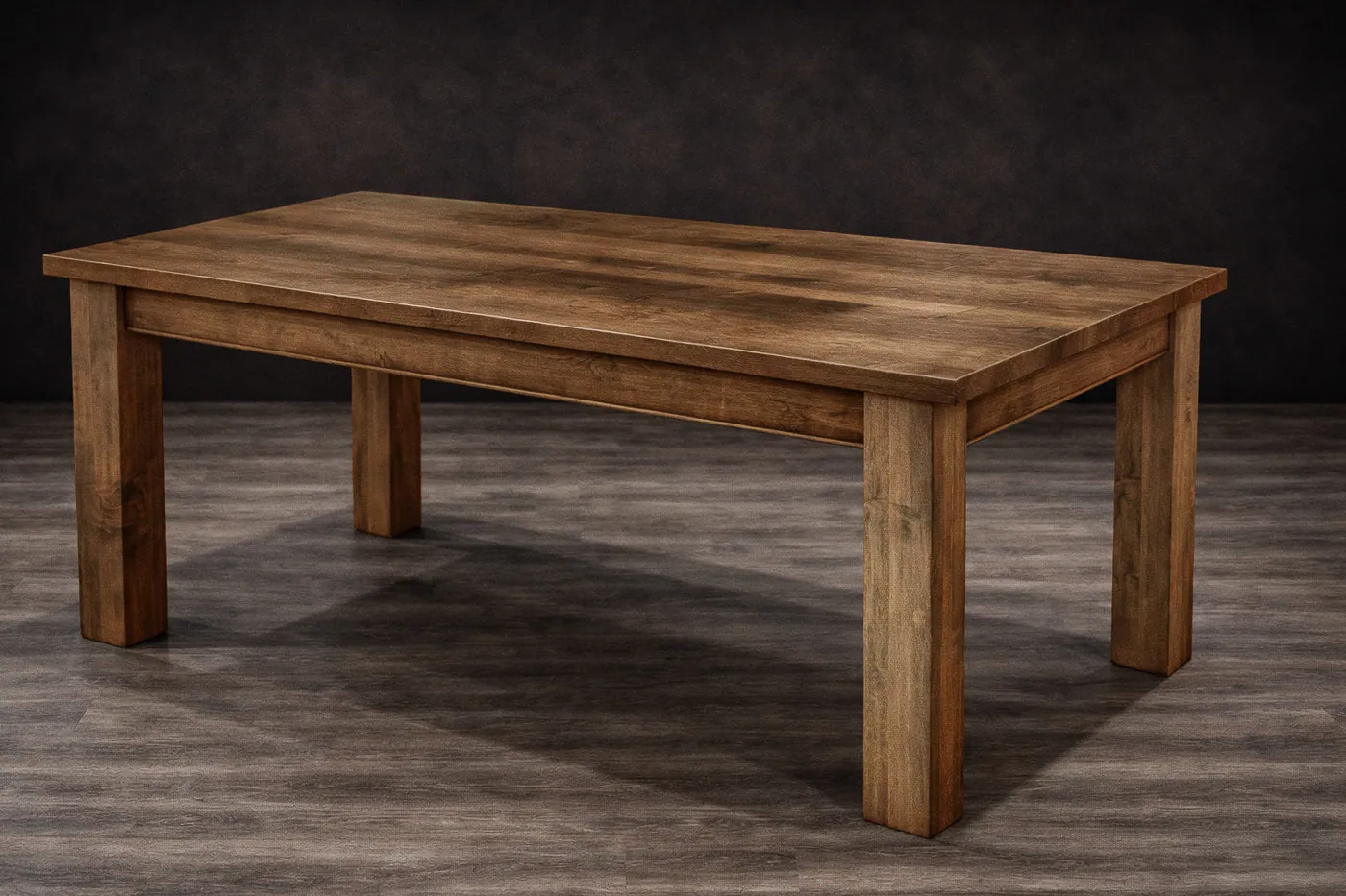 Maple dining table with rich wood stain finish.