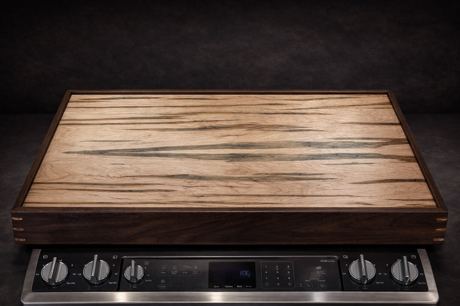 Empty ambrosia maple serving tray shown straight on over a stove.