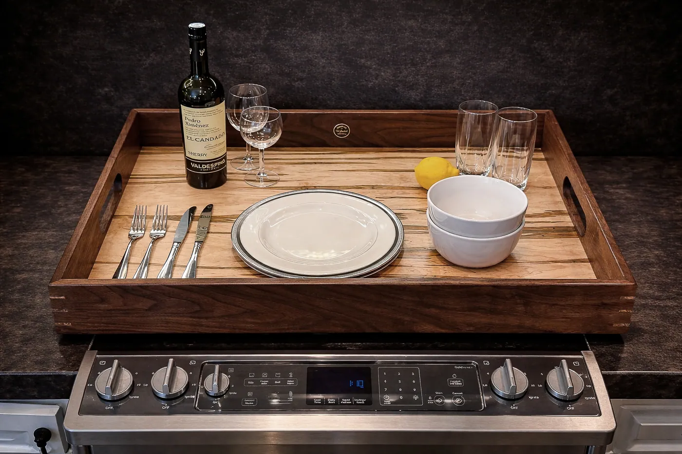 Styled ambrosia maple serving tray with walnut frame used as a range cover.